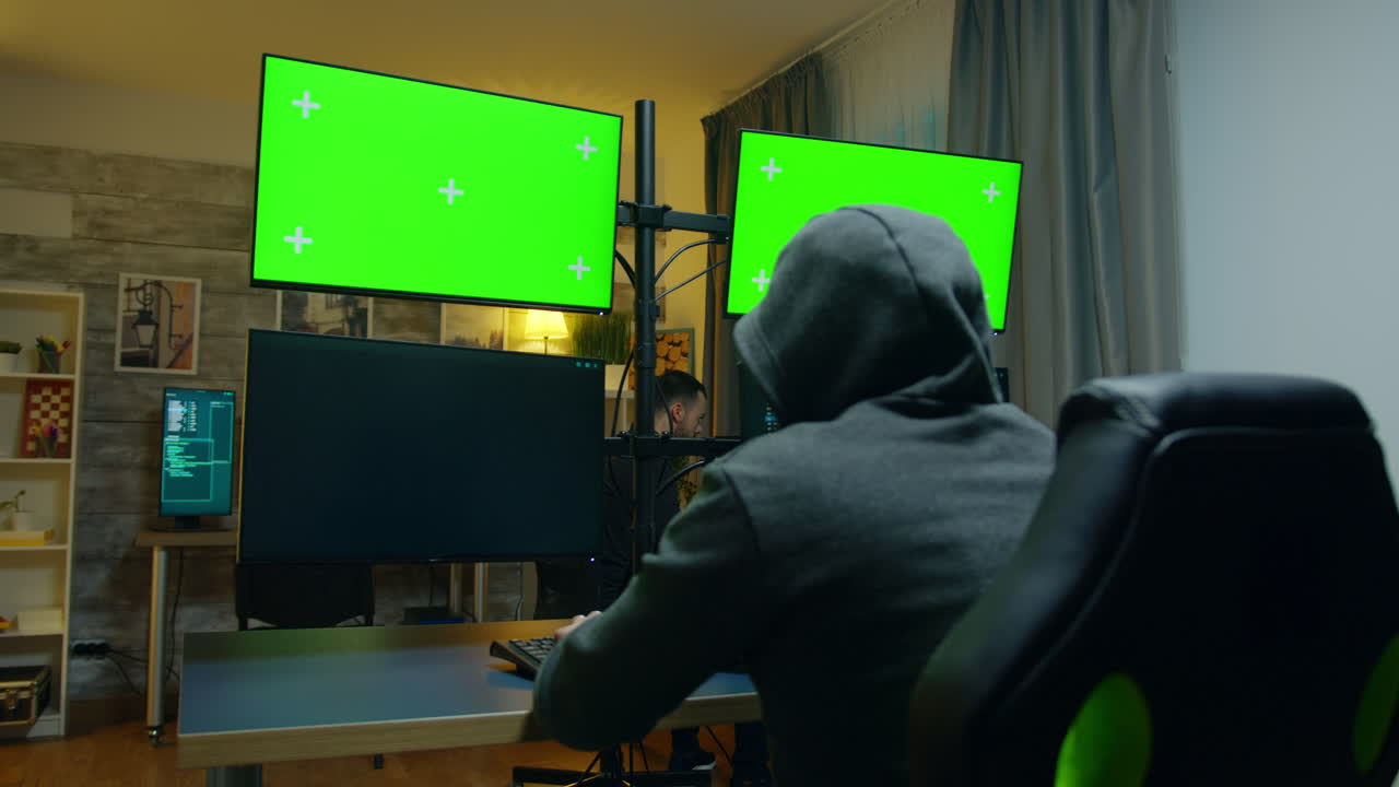 Hacker with a hoodies making a dangerous malware