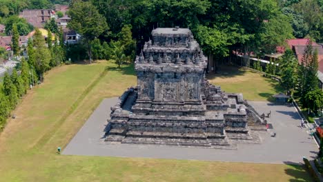 stone building of mendut temple, aerial drone orbit shot