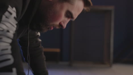 close up of a sportive man doing push ups in the gym 1