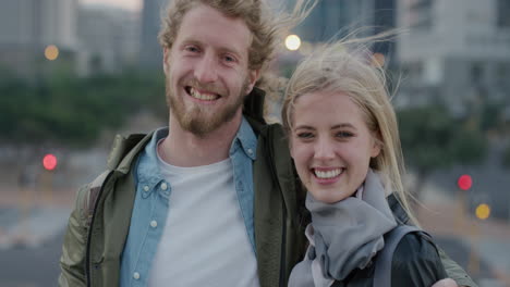 portrait-happy-young-couple-smiling-enjoying-relaxed-urban-evening-in-city-together-embracing-successful-urban-lifestyle-slow-motion