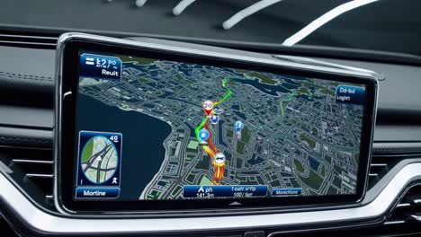 close-up of a car's dashboard gps screen displaying a 3d city map