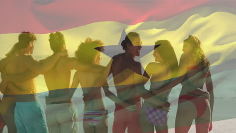 animation of waving ghana flag over diverse friends standing and forming chain at beach