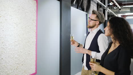 couple viewing contemporary art at an exhibition