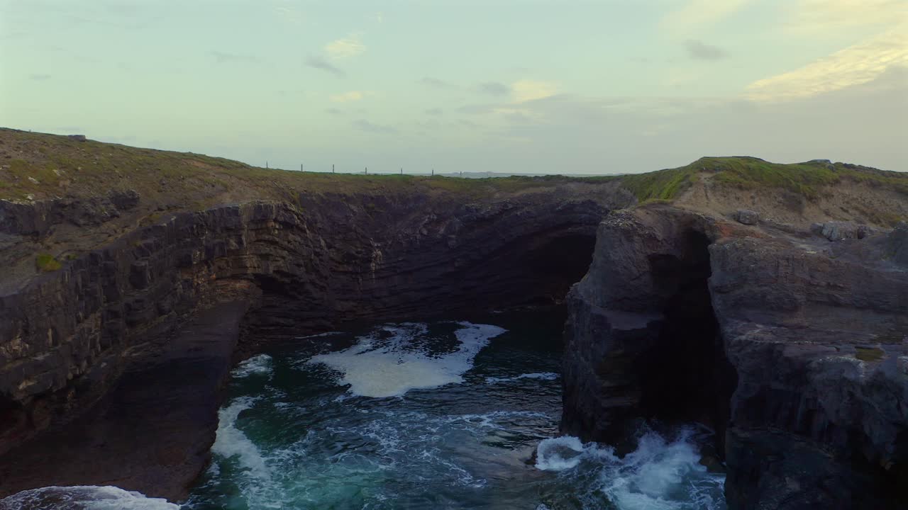 Dolly shot showcasing the intricate details of rock formations at Bridges of Ross