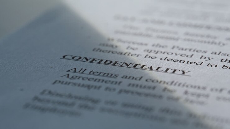 Closeup paper document confidentiality text. Macro shot security information