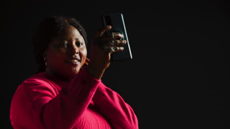 woman having video call on smartphone