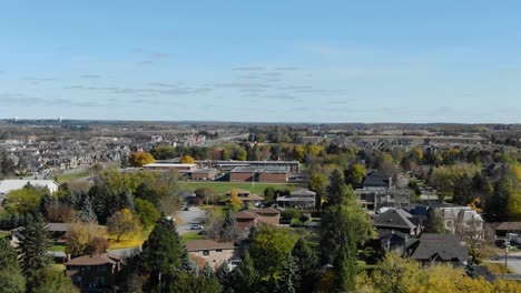 Aerial-shot-flying-toward-a-school-in-a-sunny-King-City-neighborhood