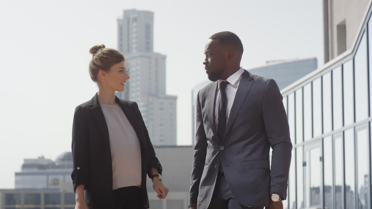 Multiethnic Business Partners Meeting Near Office