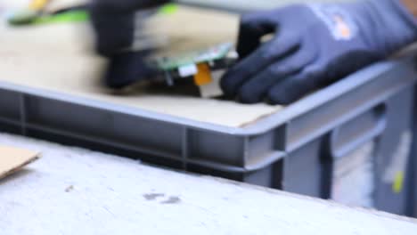 the engineer cleaning the motherboard close up