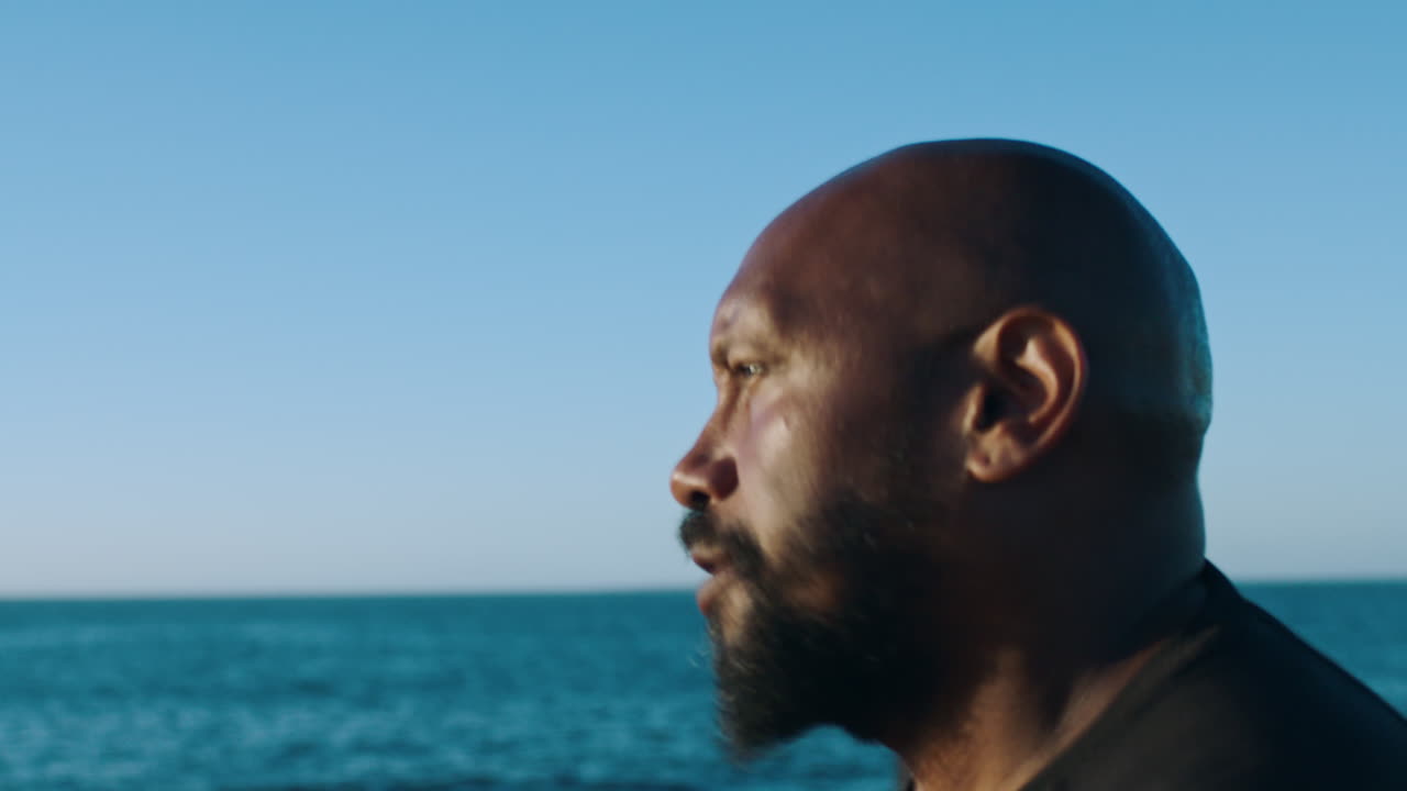 Fitness, motivation and black man running by ocean