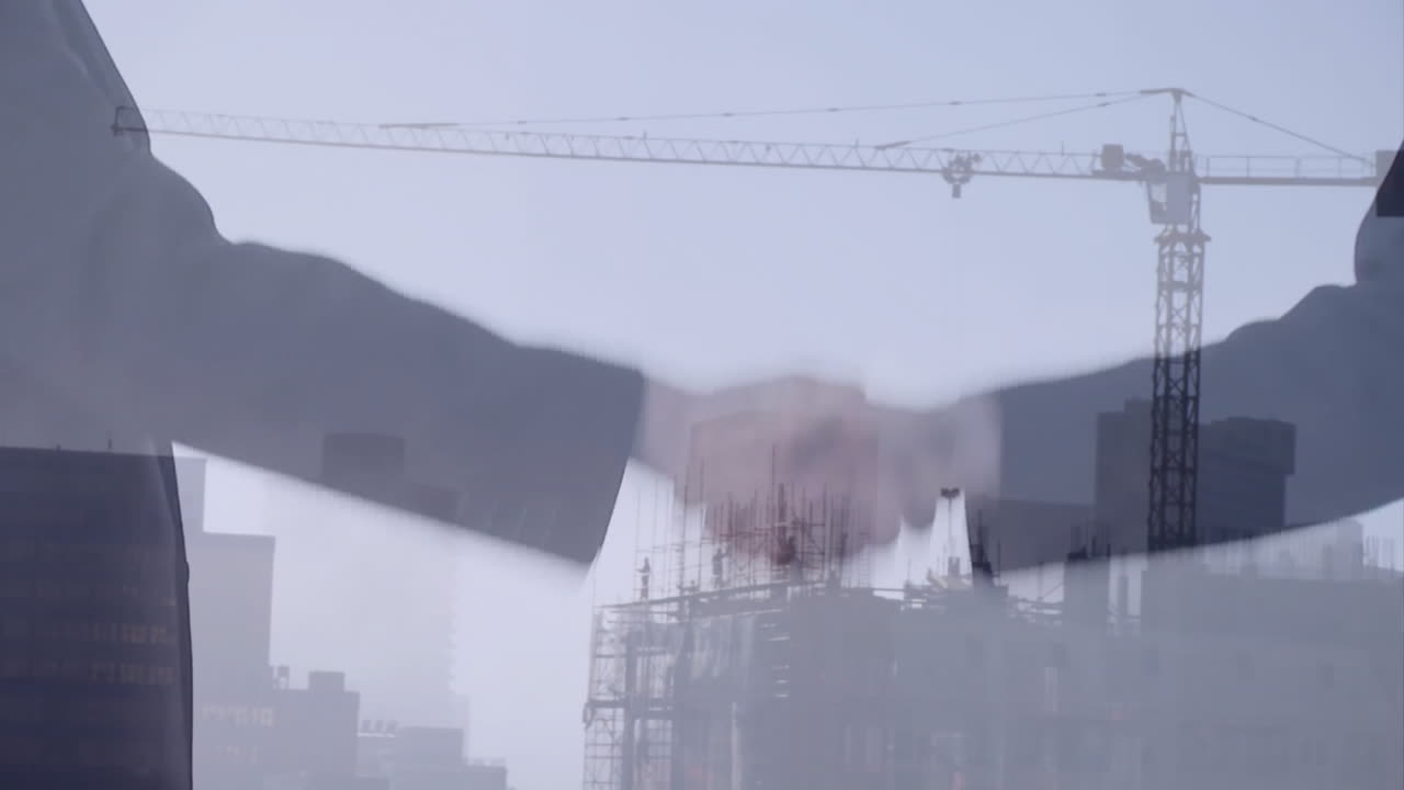 Handshake animation over construction site with cranes and buildings in background