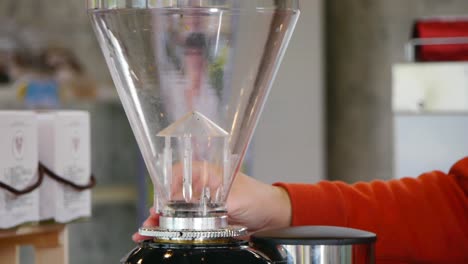 roasted coffee beans poured into coffee blender