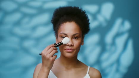 woman applying makeup