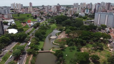 aerial flying over vitoria regia park on sunny day, bauru, sao paulo, brazil