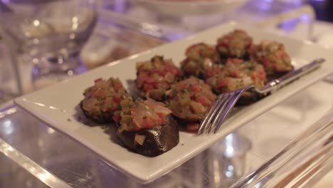 close up view of a delicious eggplant appetizers served in a plate at a wedding party