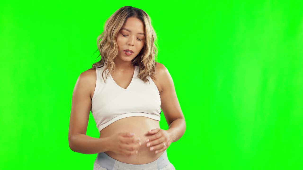 Pregnant, pain and woman with cramps on green