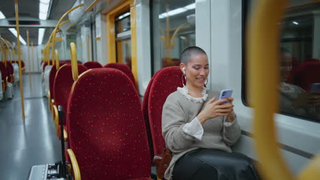 woman using phone on a train