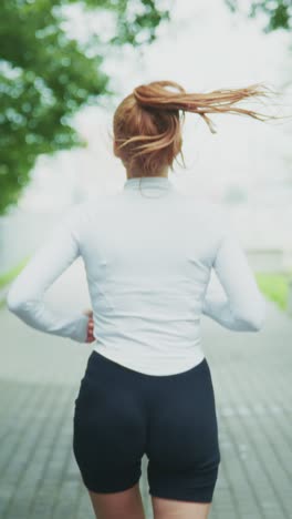 a determined runner enjoying a jog through a lush green pathway, embracing the fresh air and exercise for physical and mental well-being