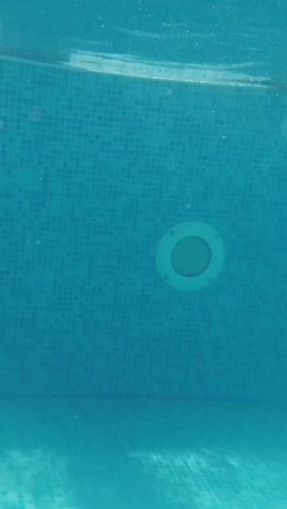 happy family with kids having fun in swimming pool