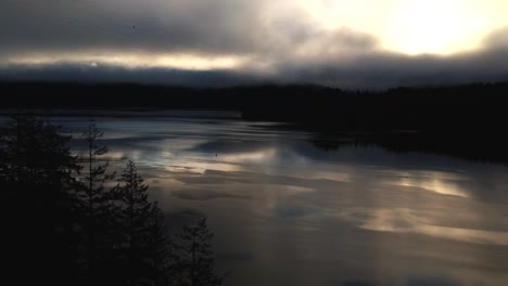 Amazing-dark-aerial-shot-of-the-Indian-Arm-fjord-in-North-Vancouver-on-an-early-morning-sunrise-with-powerful-reflections-,-Deep-Cove