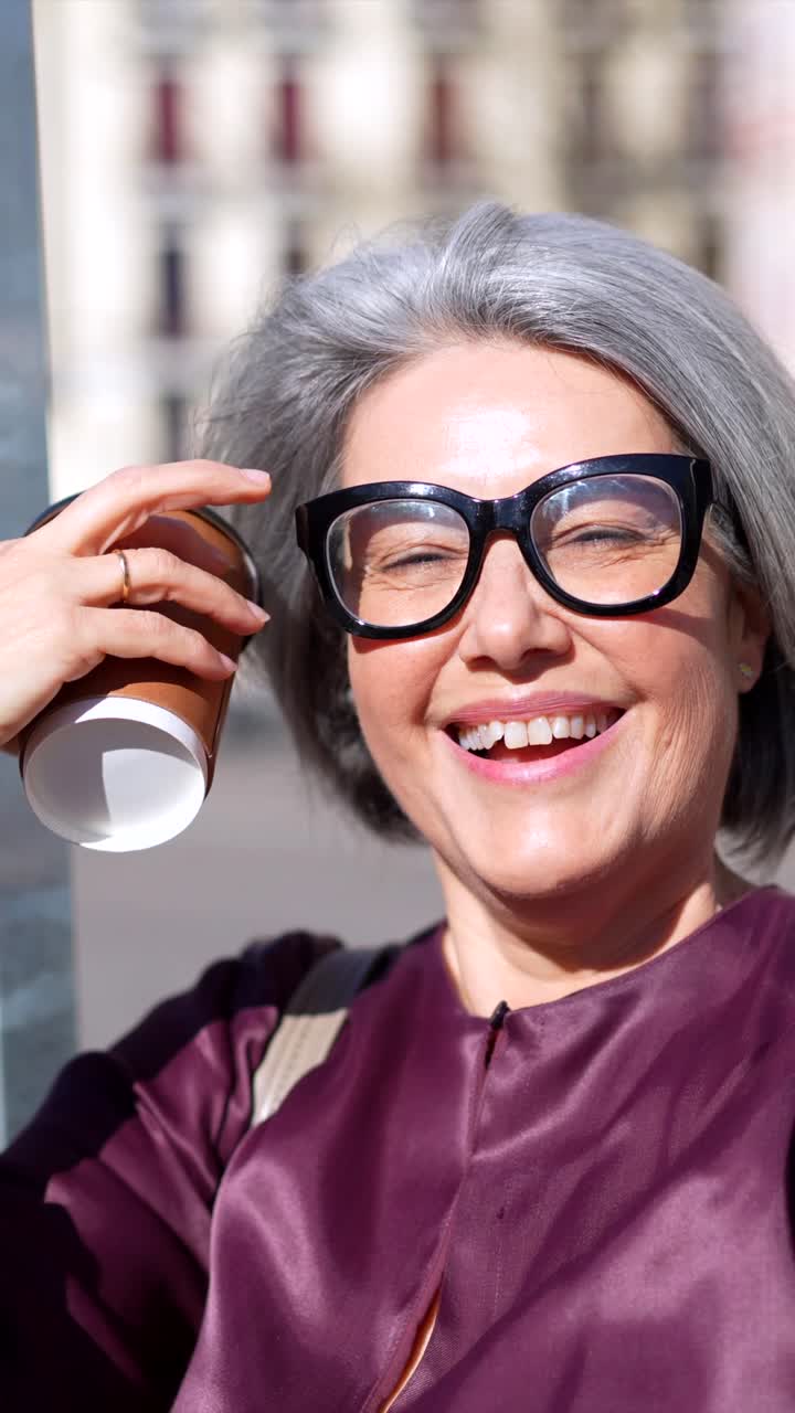Happy Senior Woman with Grey Hair Enjoying Coffee Outdoors