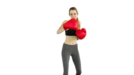 Fit-model-punching-with-red-boxing-gloves