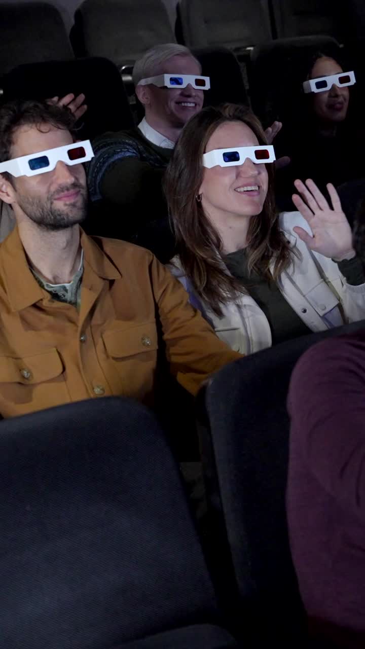 People watching a 3D movie in a theater