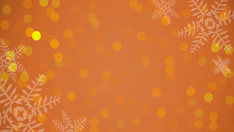 animation of christmas snowflakes and glowing spots on orange background