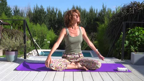 young caucasian woman practicing yoga on a sunny morning