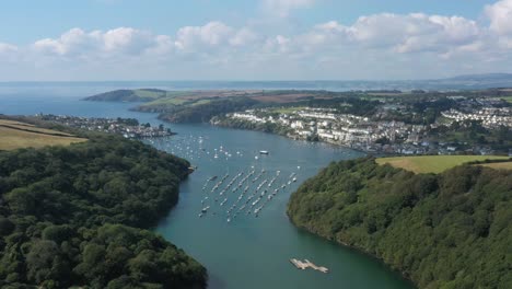 wide view over the river fowey, looking towards the sea and the towns of polruan and fowey in the cornish area of outstanding natural beauty, uk