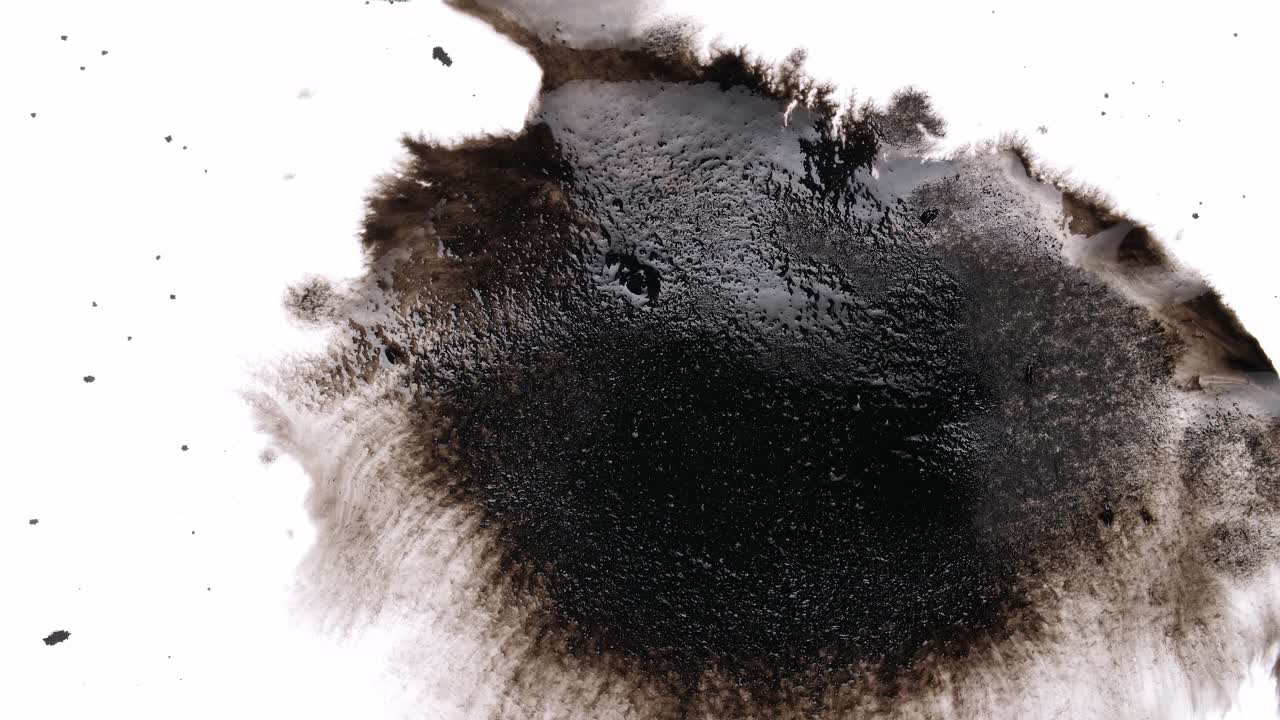 Black Ink Drops On White Background