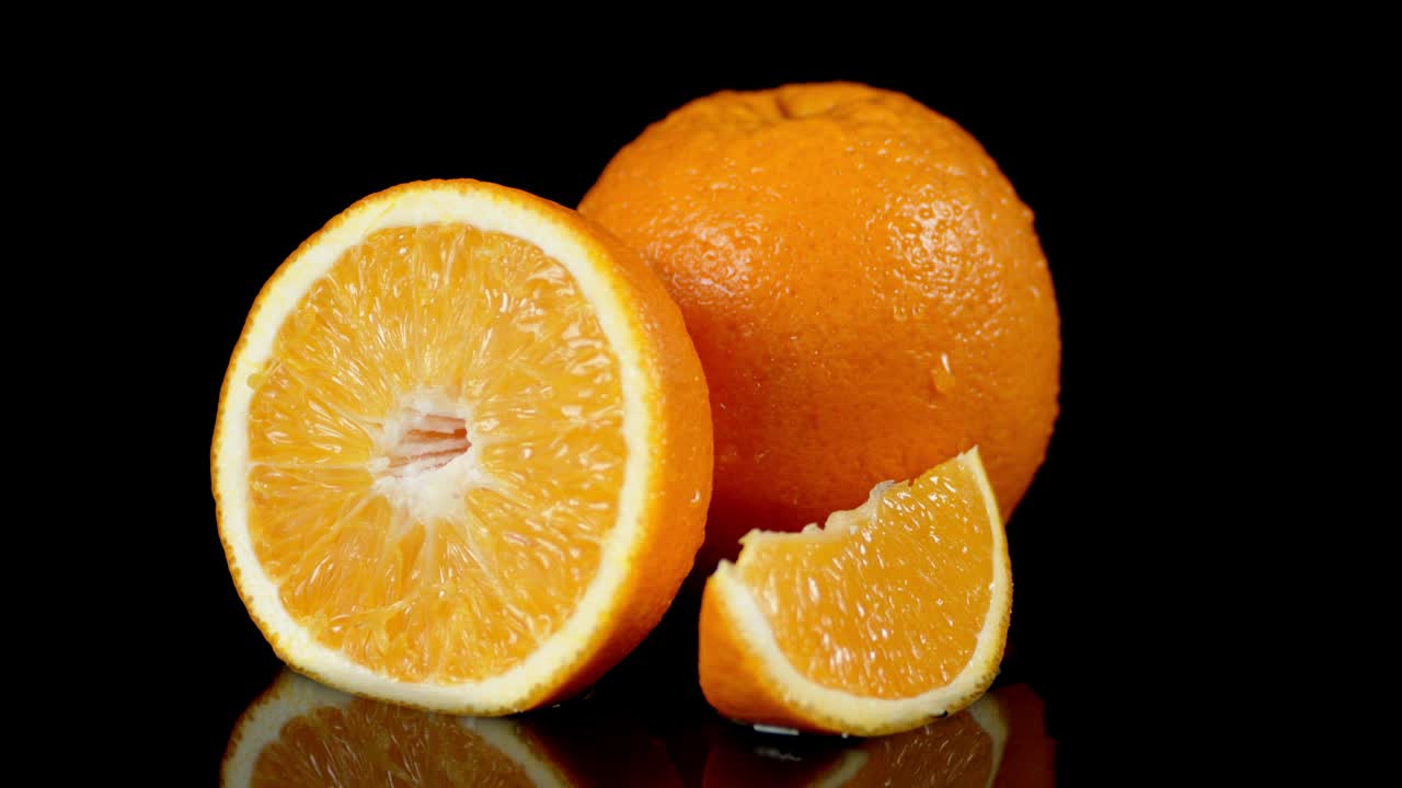 The orange slice falls into the water.