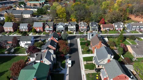 American-neighborhood-with-USPS-mail-truck.-Aerial-shot