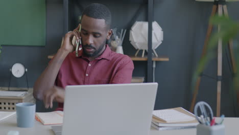 man on phone call at a desk
