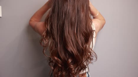 woman with long curly brown hair