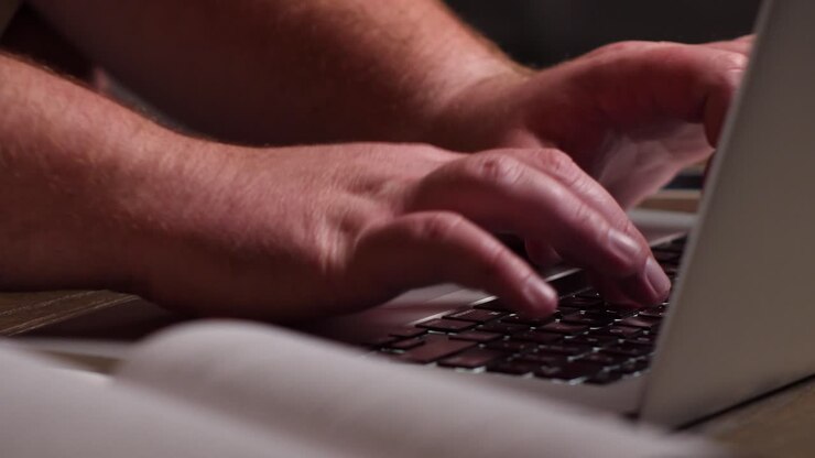 Caucasian Man Remote Working From Home with Laptop