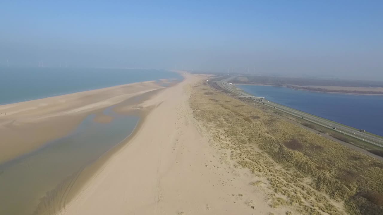 Aerial view of coast with beach and highway