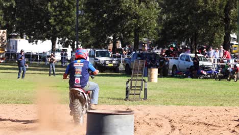 motorcyclist performing in a dirt track event