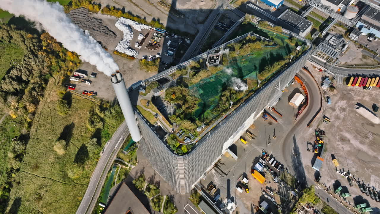 Aerial drone view of CopenHill artificial ski slope on the roof of an energy plant