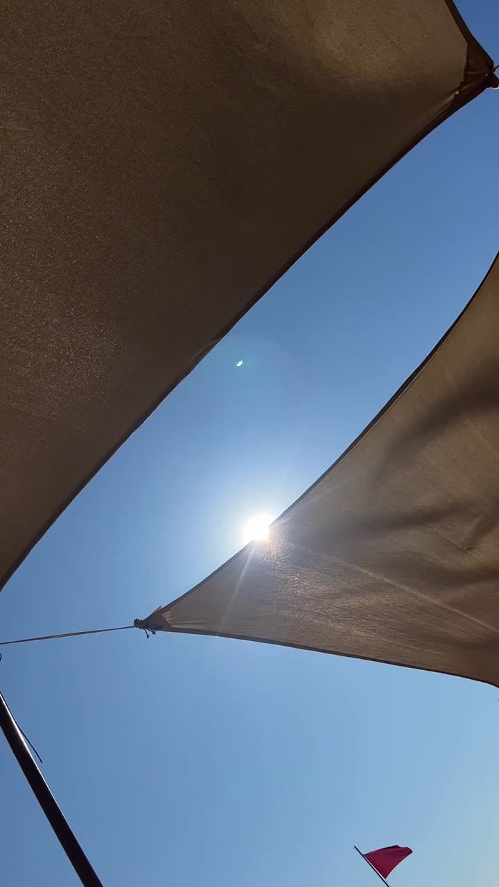 View of the sky through a shade sail
