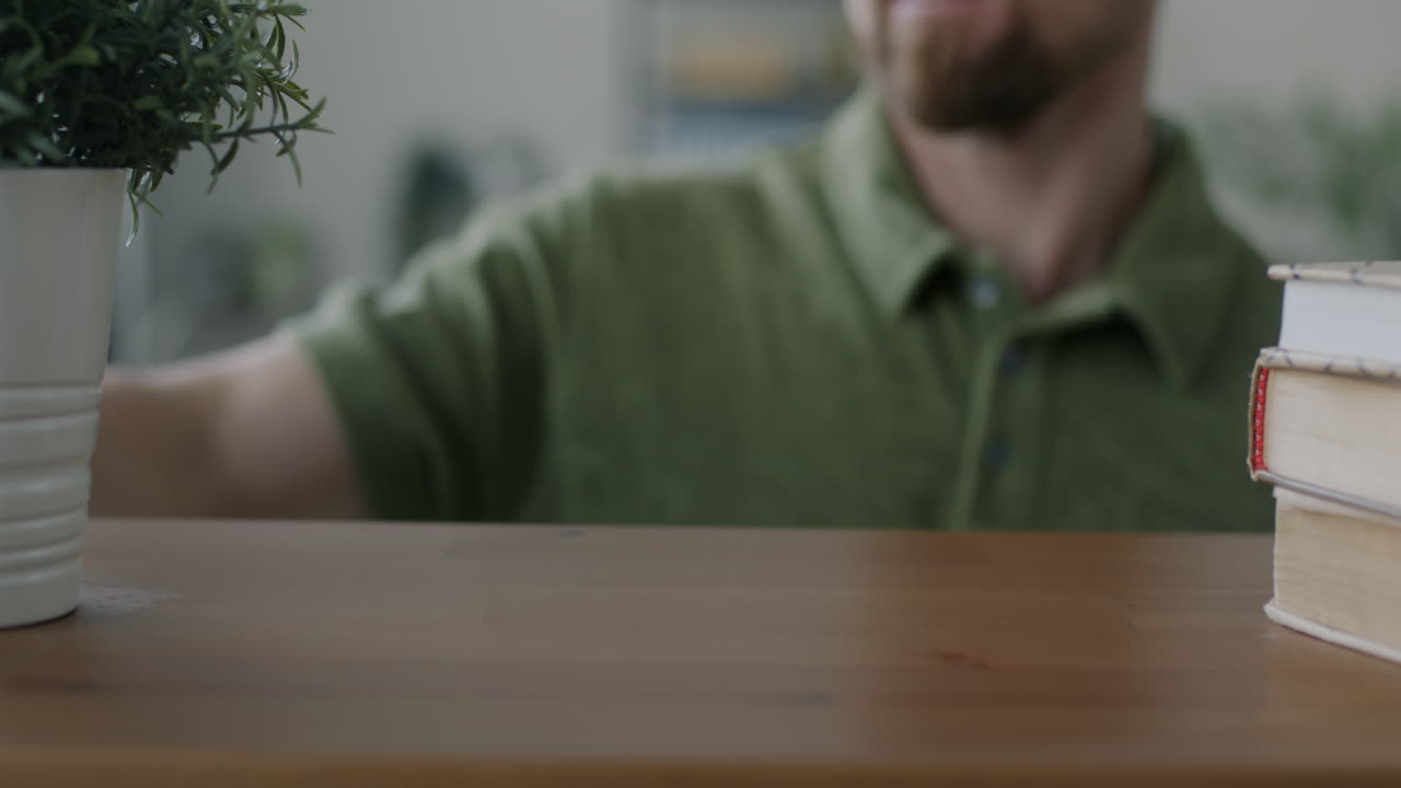 Man Cleaning a Wooden Table