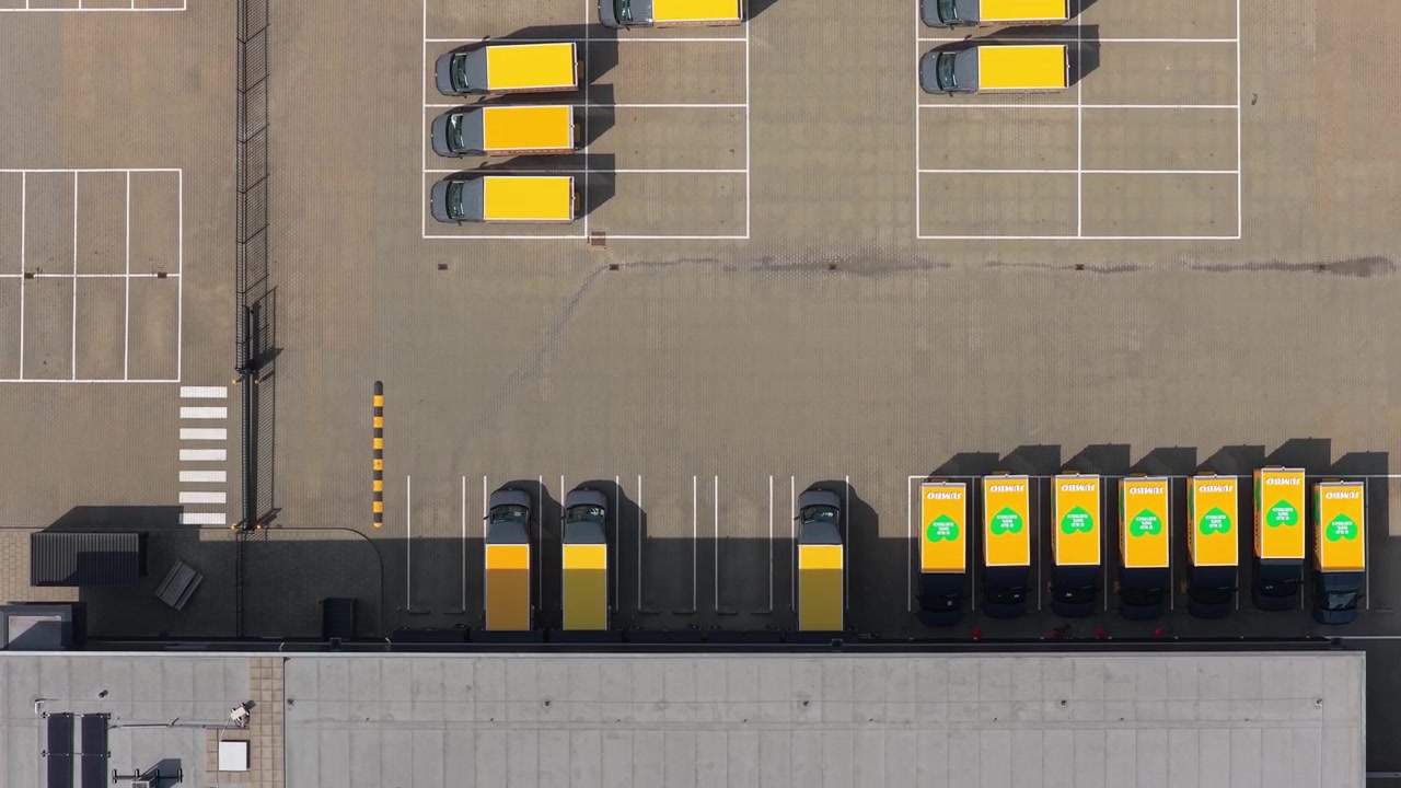 Aerial View of Delivery Vans Parking at Distribution Center