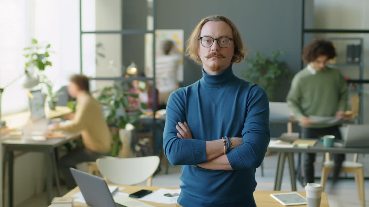 Portrait of Businessman during Workday in Office