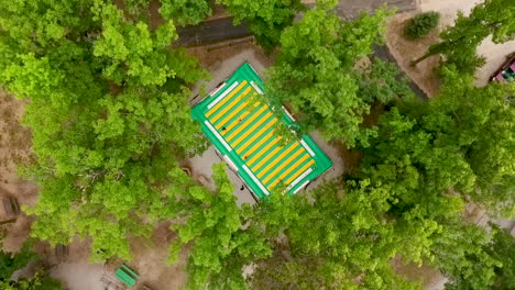 lowering drone shot bounce pillow in park