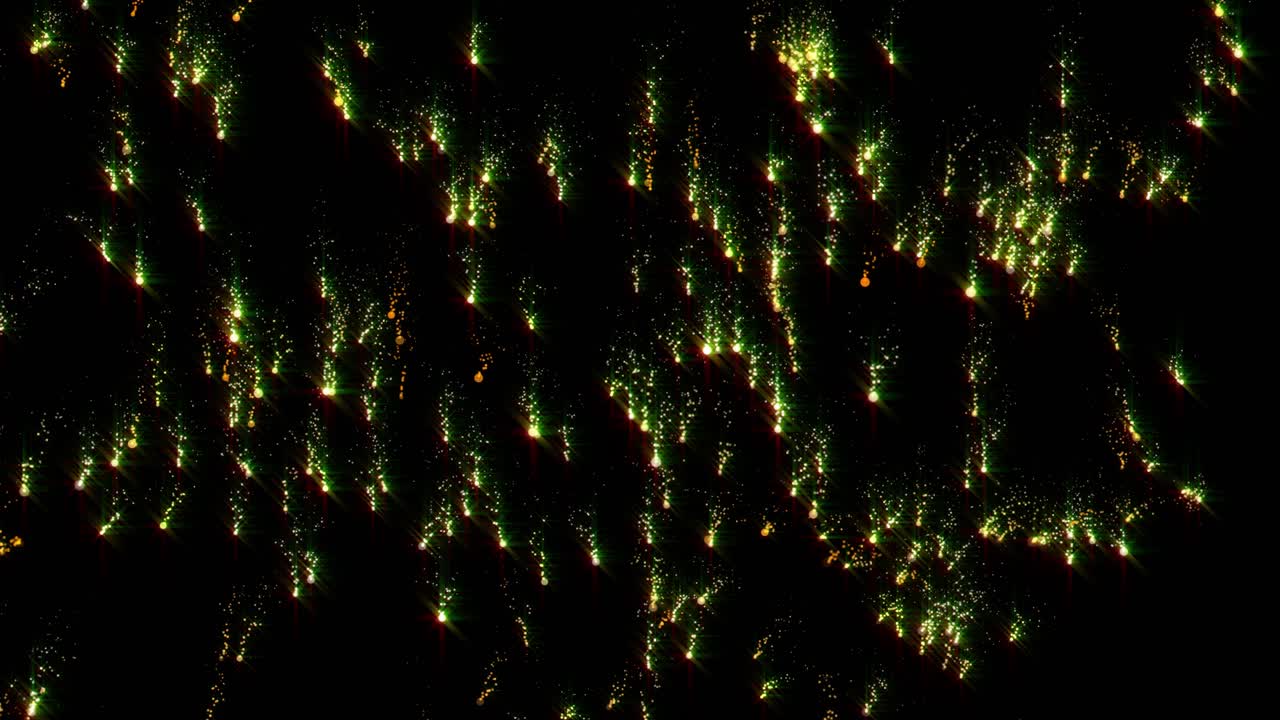 초록색과 금색의 불꽃놀이가 반인다