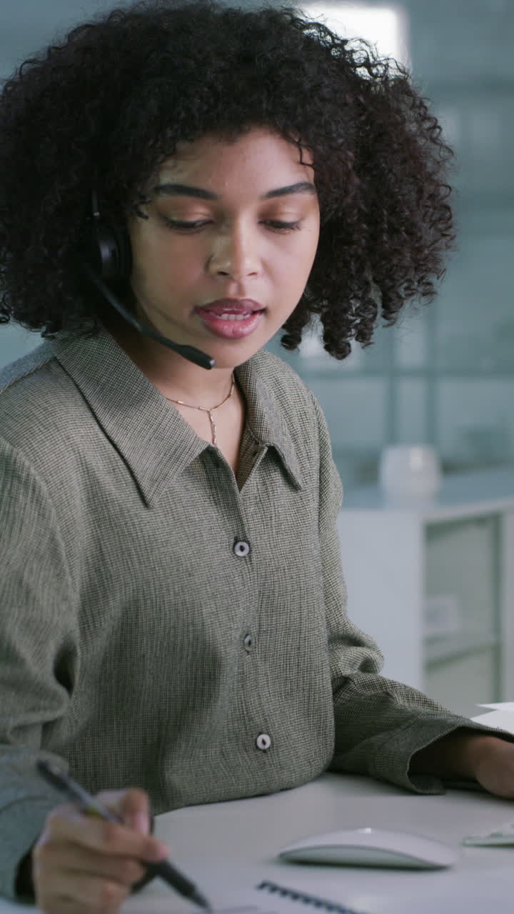 Young Woman Wearing Headset Working in Call Center Office