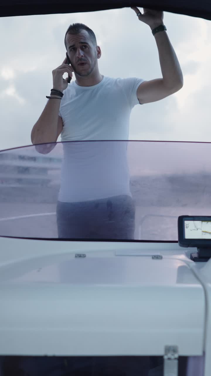Man on a boat using a phone