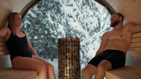 Caucasian-adult-couple-enjoying-in-the-sauna-in-winter.