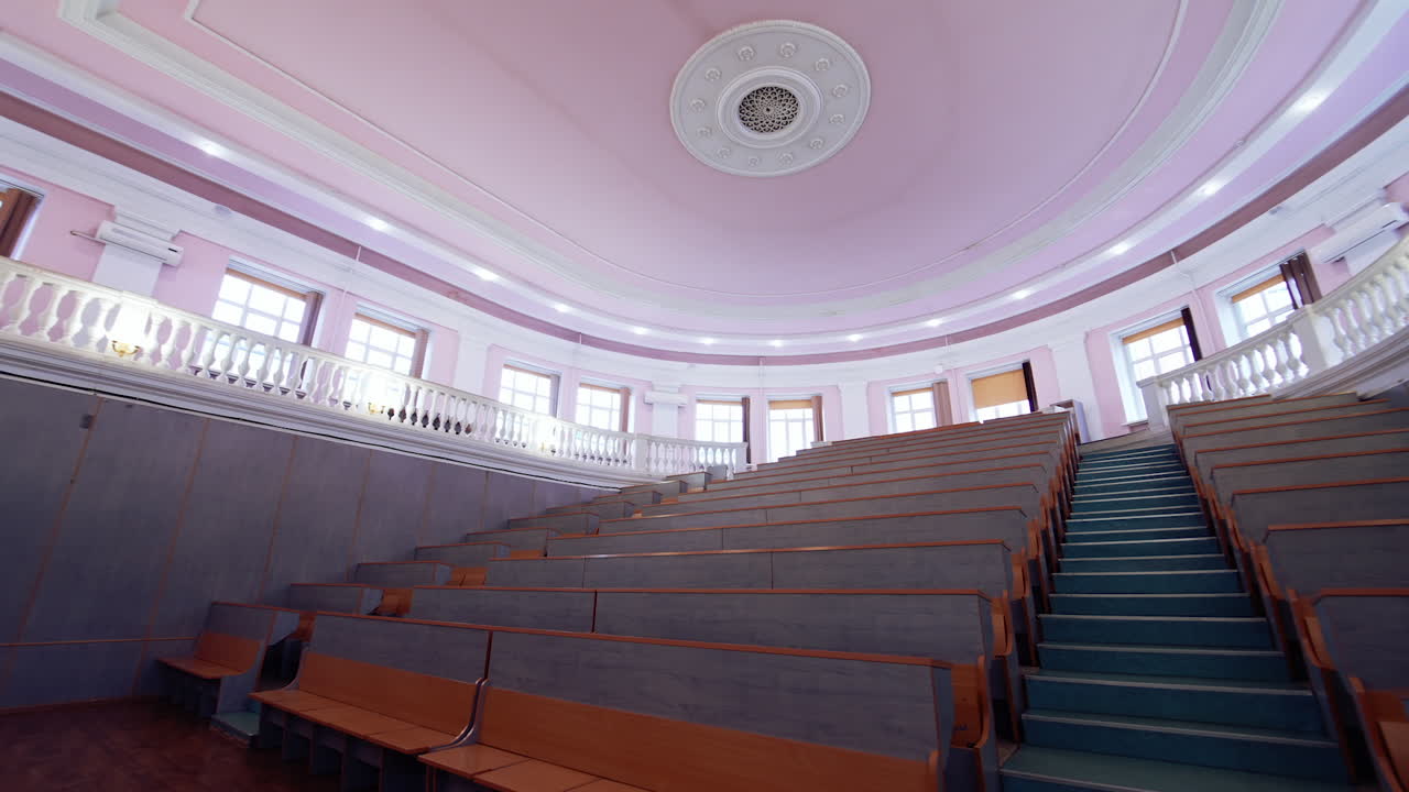 Interior of big auditorium. Inside university lecture hall with nobody inside.