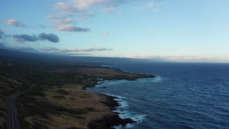 aerial wide rising shot of an ancient mauna loa lava flow along the southern coast of hawai'i